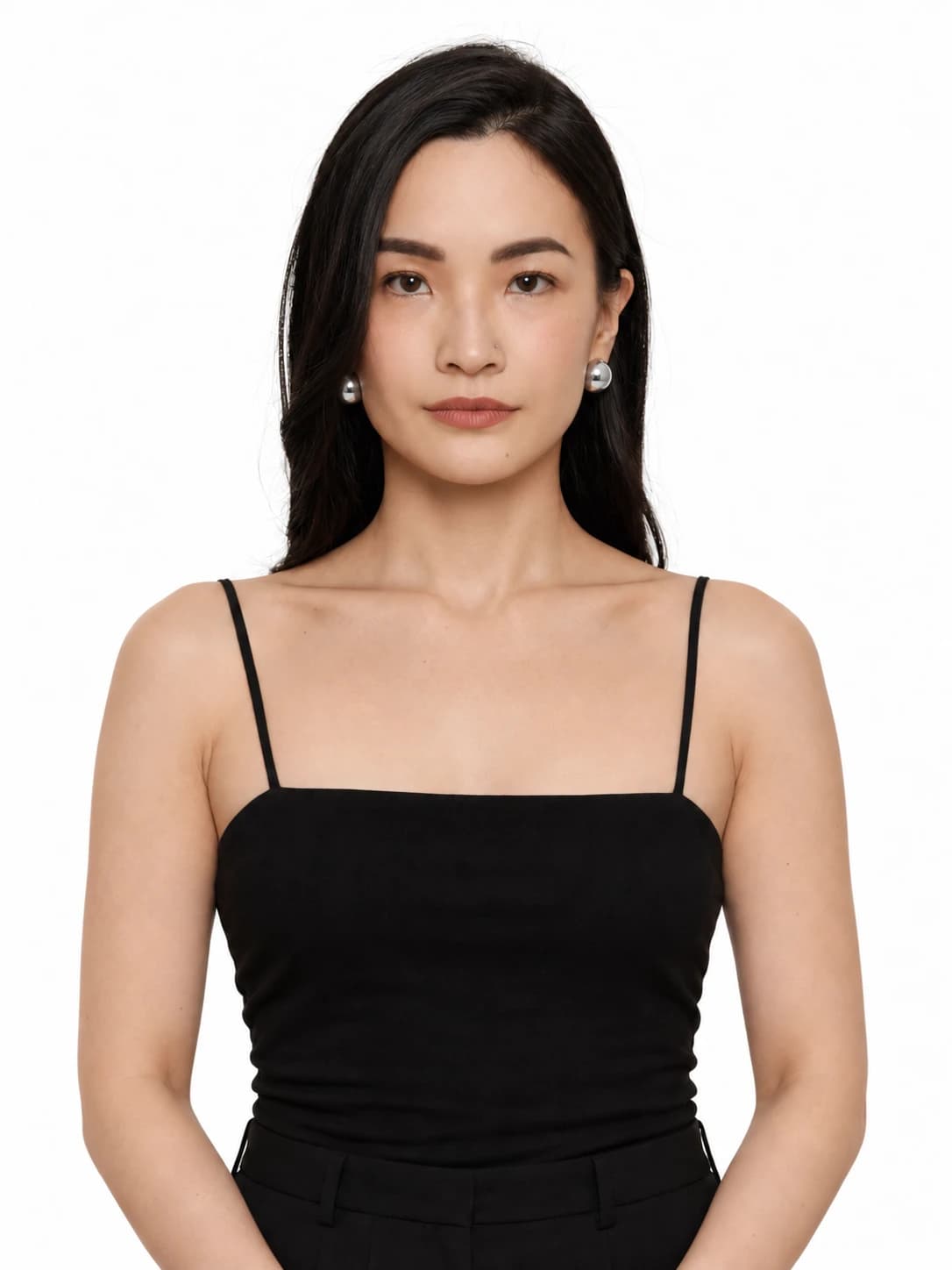 Human portrait with dark hair, silver studs and a bare neckline.